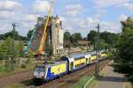146 -04 verl�sst den Bahnhof Tostedt. Im Hintergrund: die Abrissarbeiten der alten Siloanlagen, die alten Lagerhallen links und rechts vom Silo sind schon 'platt'! Datum: 06.08.2026