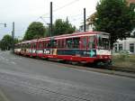 Eine Doppeltraktion aus Stadtbahnwagen B ist am 11.06.2004 am Rheinbahnhaus in D�sseldorf-Oberkasseler unterwegs.